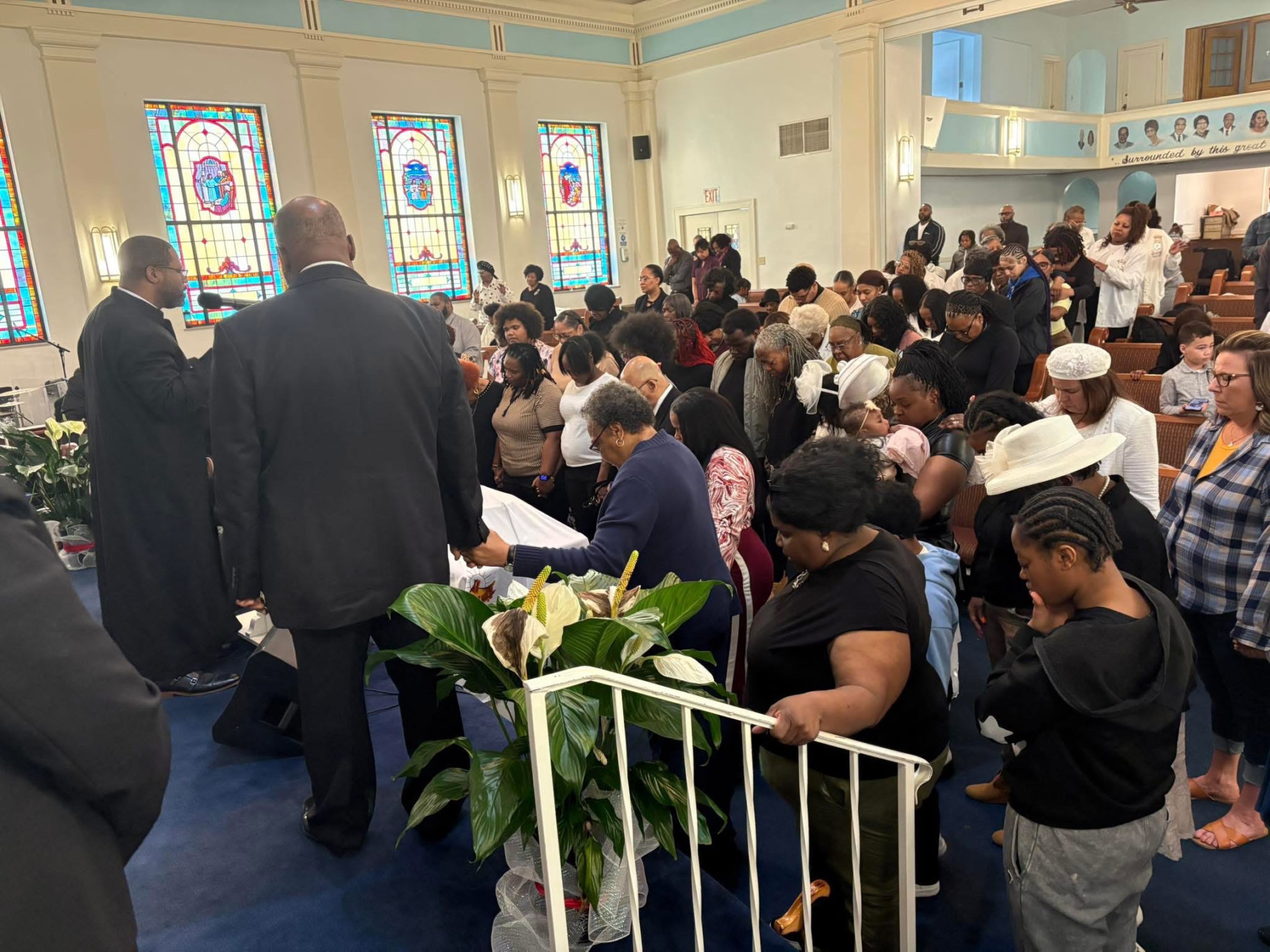 The Second Baptist congregation gathered at the altar for prayer